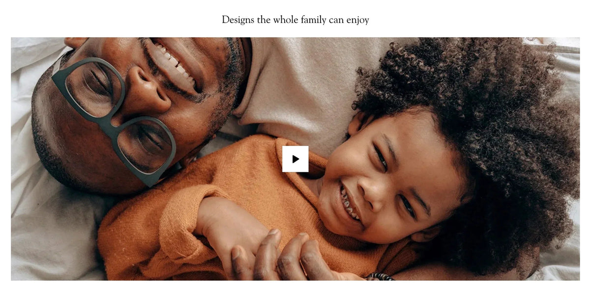 Father and child smiling together, cozy family moment with warm clothing and joyful expressions
